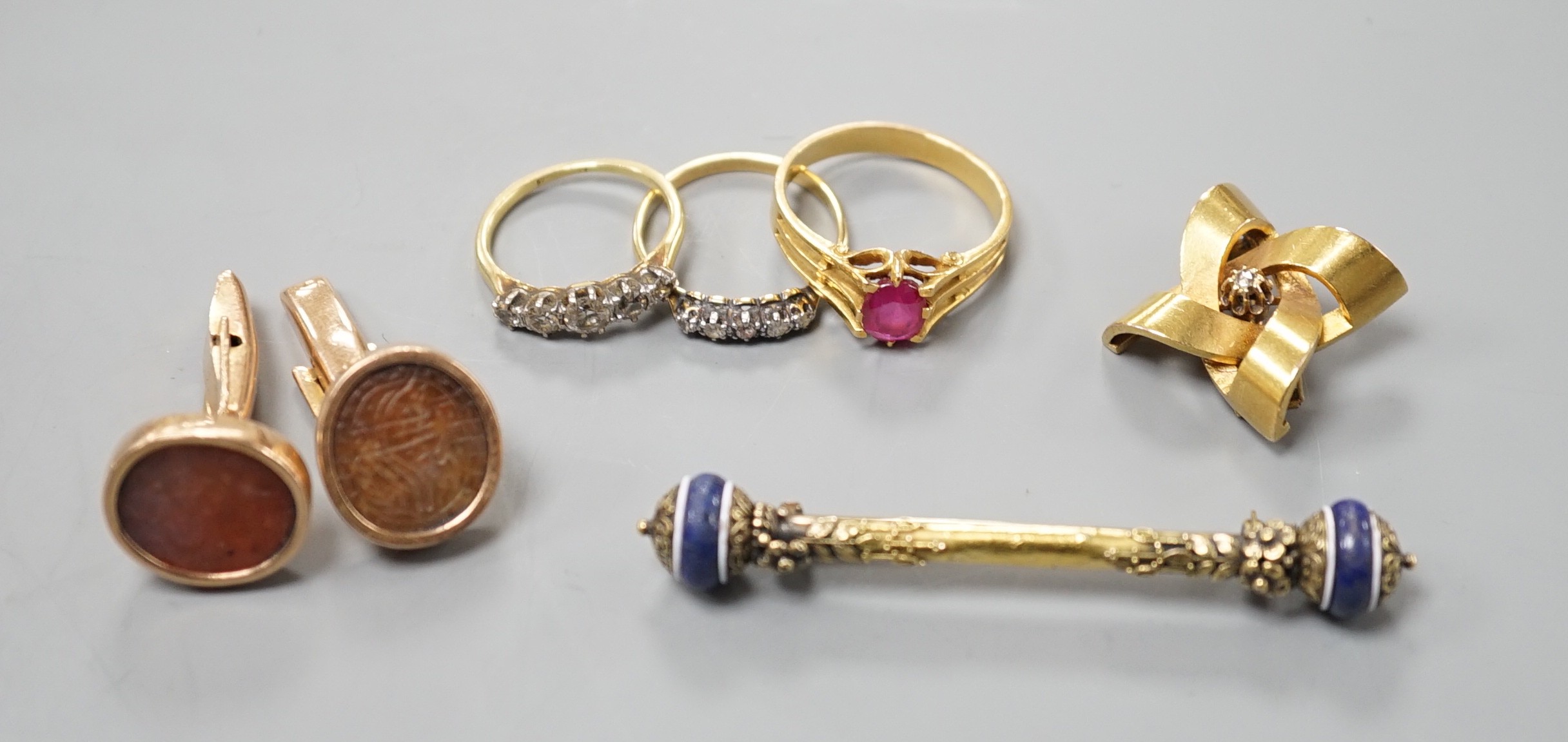 A group of mixed jewellery including two 18ct and diamond half hoop rings, a pair of Middle Eastern yellow metal and talismanic carnelian intaglio cufflinks, a yellow metal and diamond set brooch, a synthetic? ruby set y